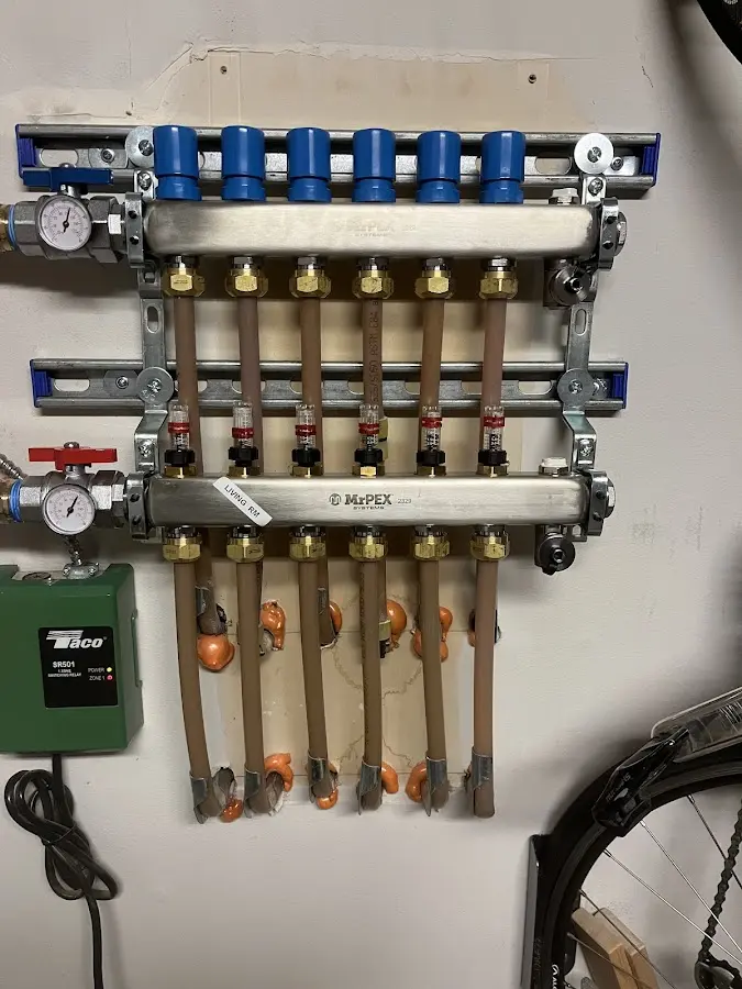 Plumber performing Water Heater Repair at a residential property in Jeannette